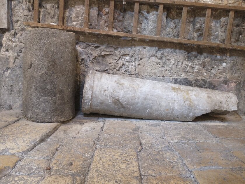 Broken stone column on the floor of the Church of the Holy Sepulchre.