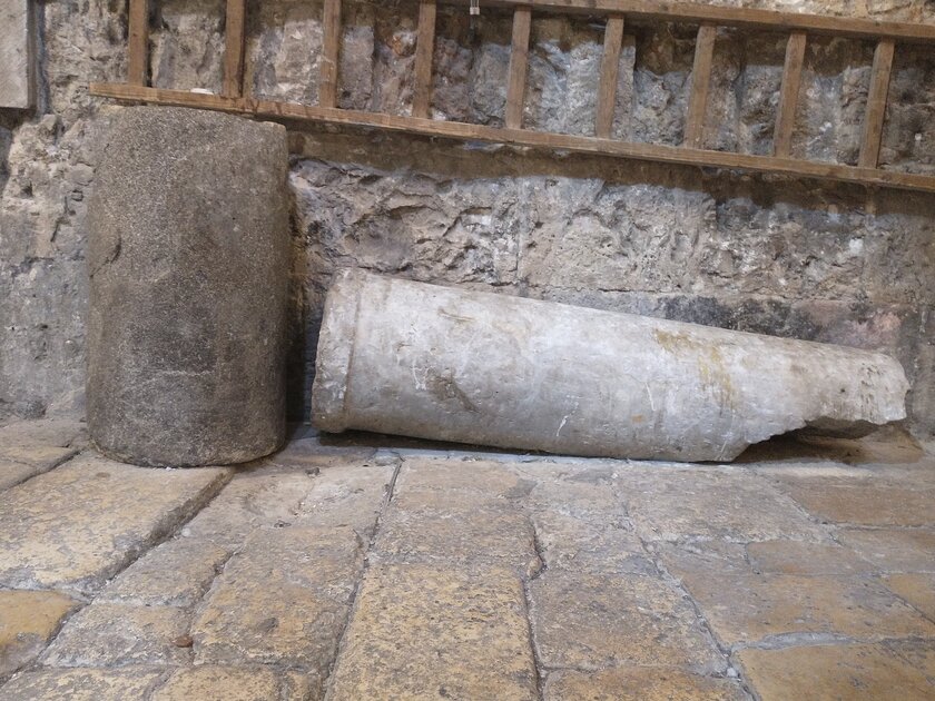 Broken stone column on the floor of the Church of the Holy Sepulchre.